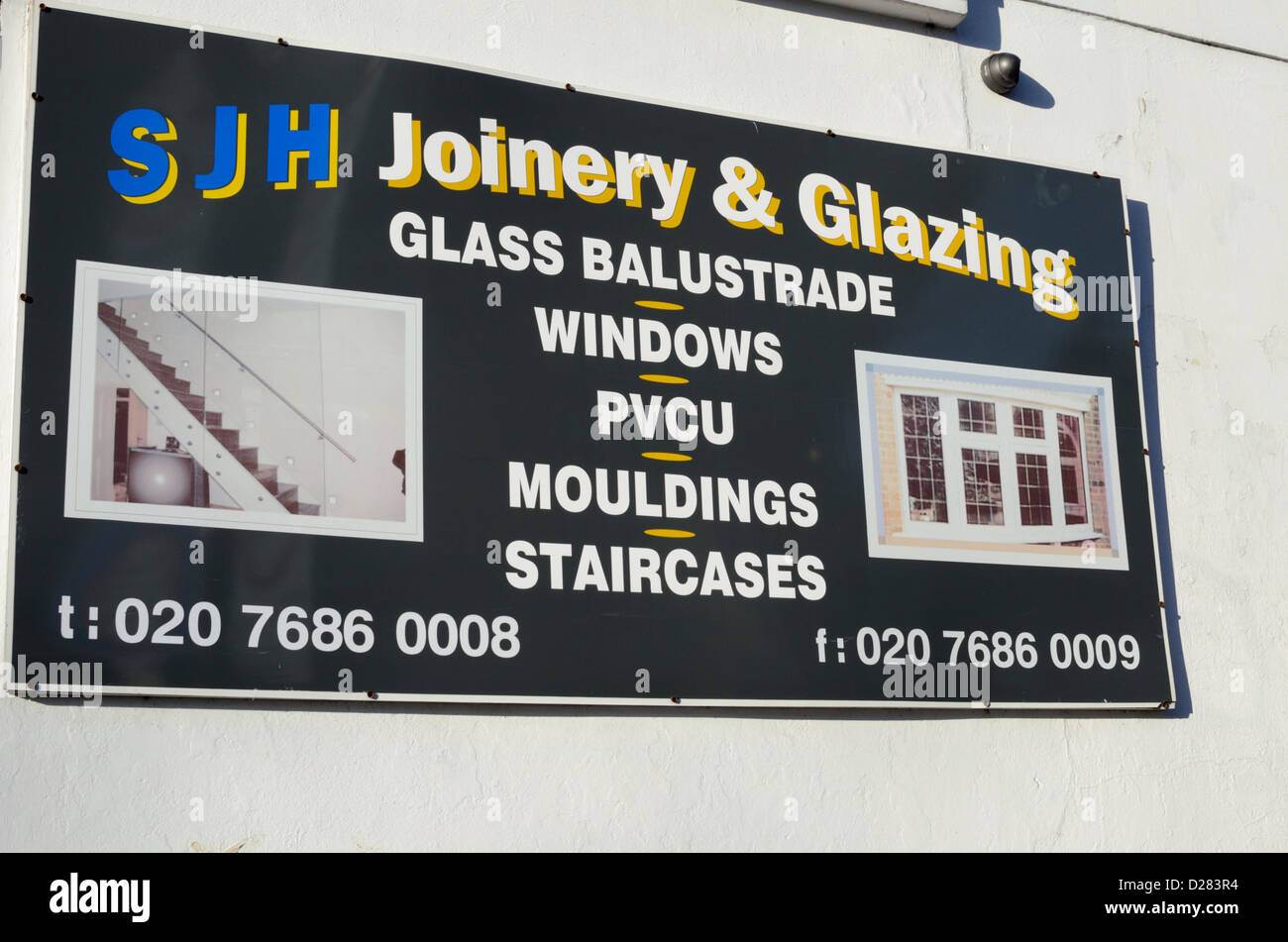 Joinery and glazing advertisement on a wall, London, UK Stock Photo Alamy