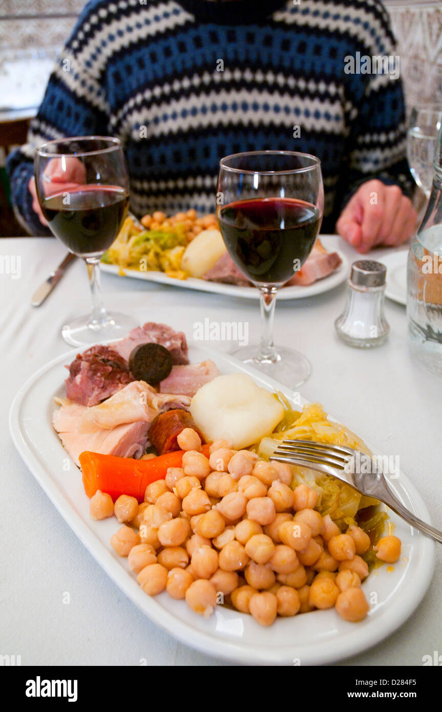 Cocido madrileño serving in a restaurant. Madrid, Spain. Stock Photo