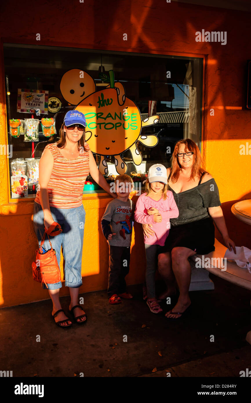 Mother children and Aunt outside a candy store on Siesta Key Island Florida Stock Photo