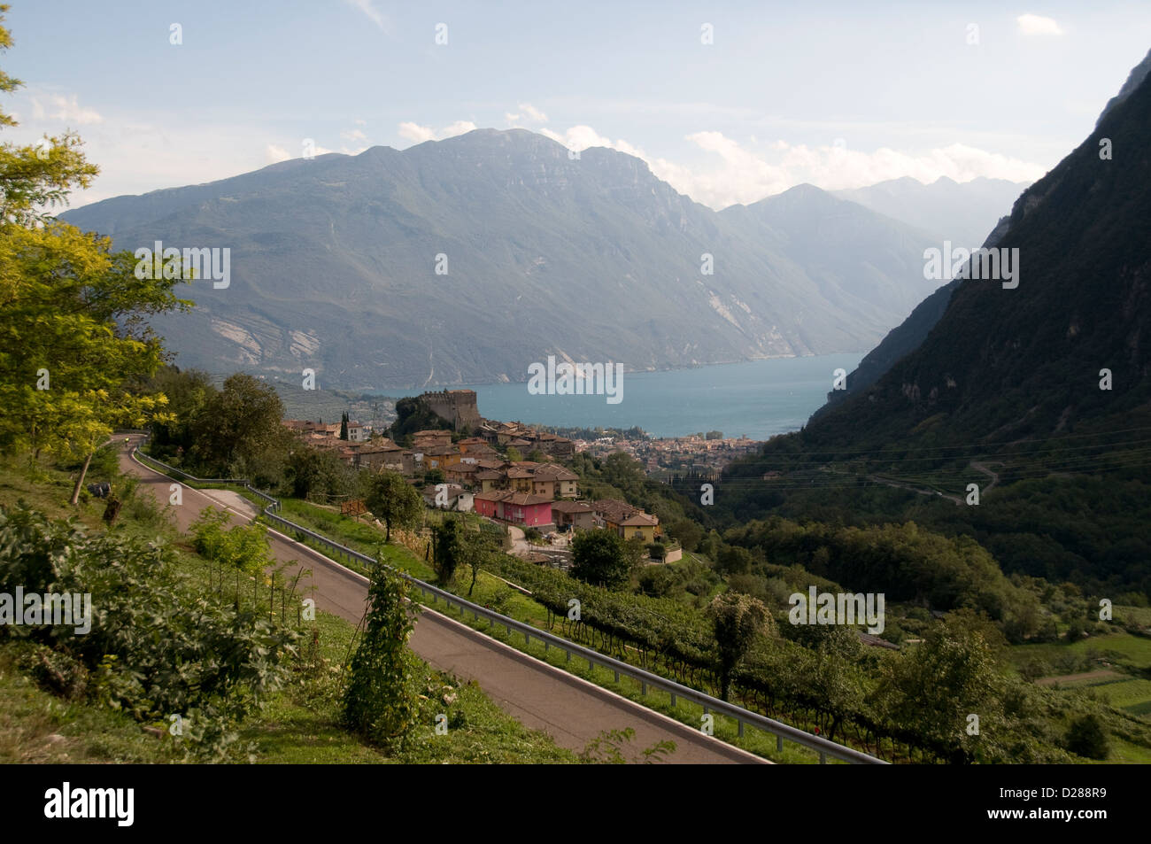 High mountain view of Lake Garda and the Garda mountains from the well-preserved time-warped rural mountain medieval village of ‘Tenno’, with a Stock Photo