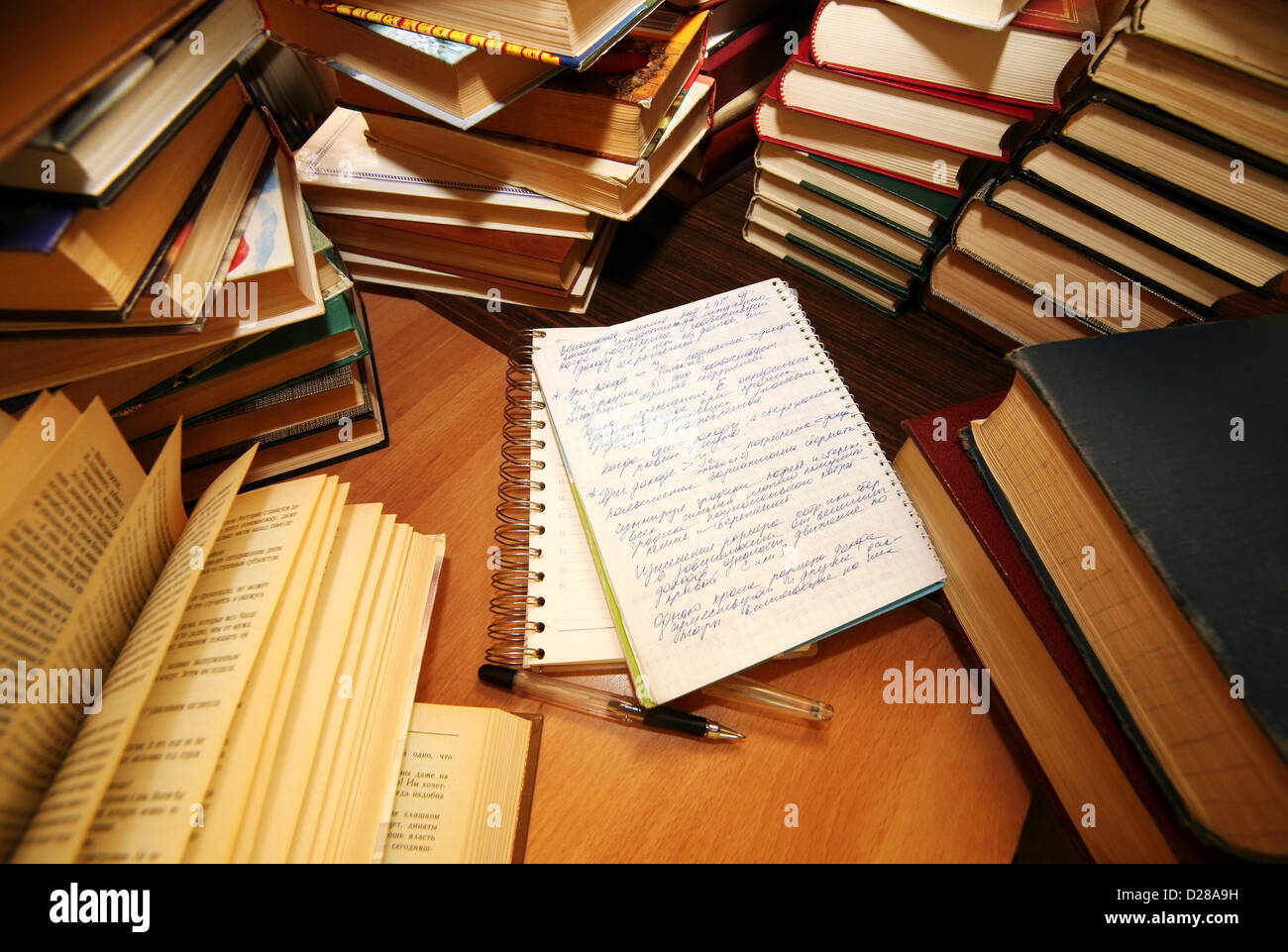 Many old books combined by a heap. Russian saying 'Knowledge - light, ignorance - darkness' Stock Photo