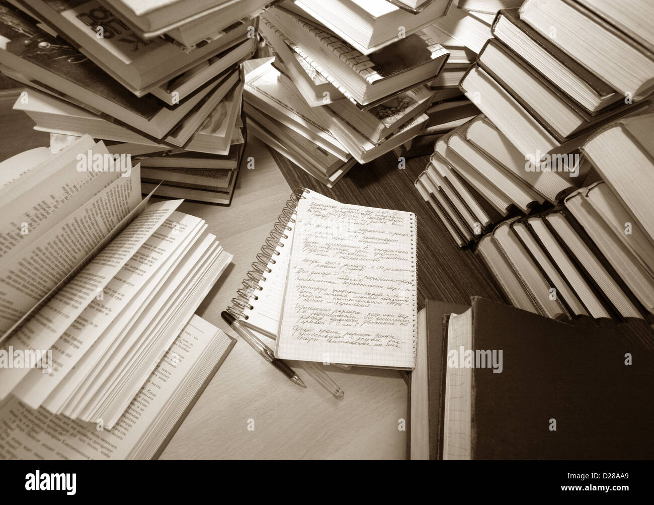 Many old books combined by a heap. Russian saying 'Knowledge - light, ignorance - darkness' Stock Photo