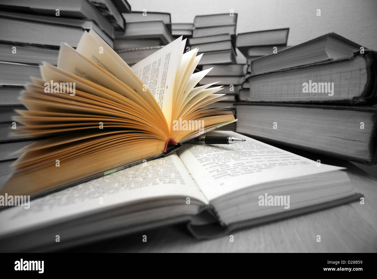 Many old books combined by a heap. Russian saying 'Knowledge - light, ignorance - darkness' Stock Photo