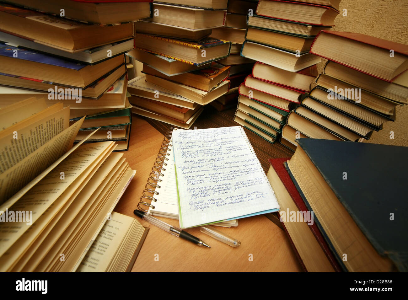 Many old books combined by a heap. Russian saying 'Knowledge - light, ignorance - darkness' Stock Photo