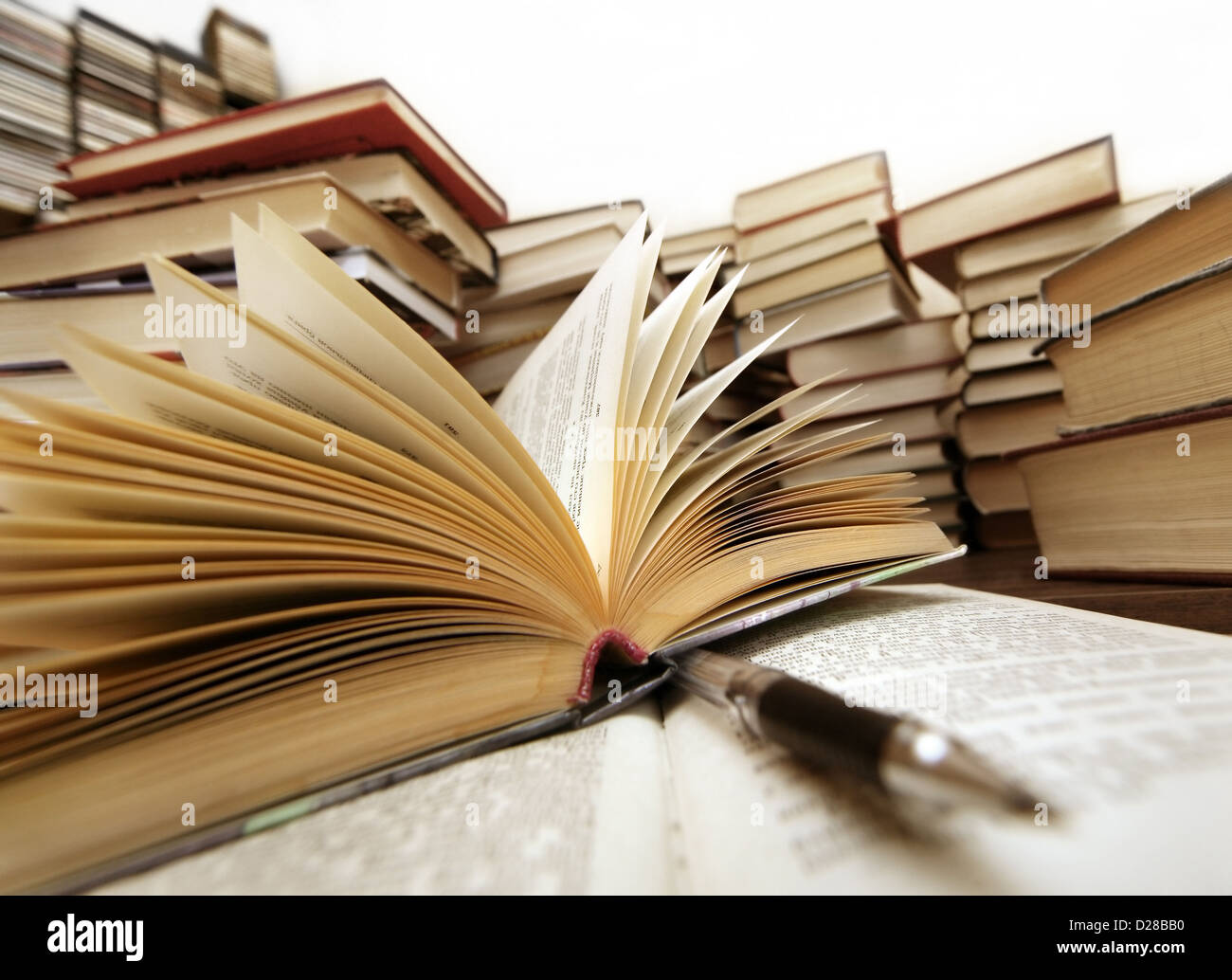 Many old books combined by a heap. Russian saying 'Knowledge - light, ignorance - darkness' Stock Photo