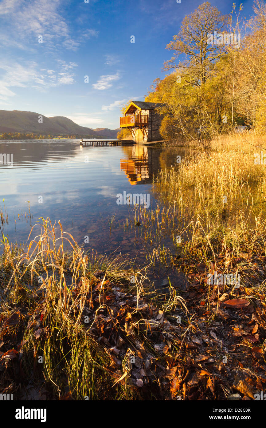 A boathouse near Pooley Bridge in the Lake District National Park.  Captured from the waters edge on a cold still morning in Oct Stock Photo