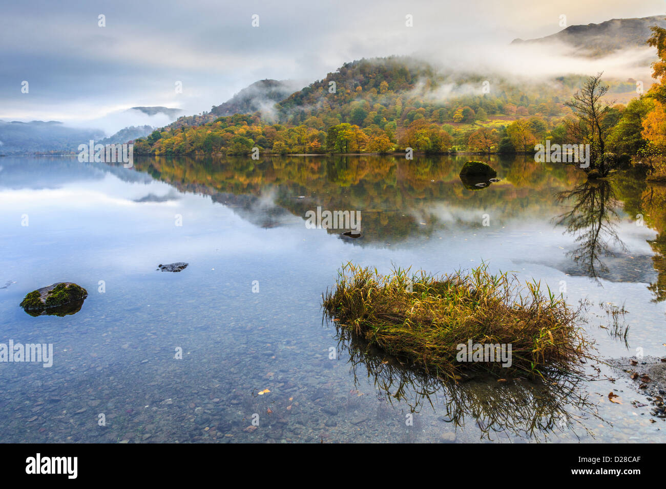 Ullswater in the Lake District National Park captured during a brief spell of weak sunlight on an atmospheric morning in October Stock Photo