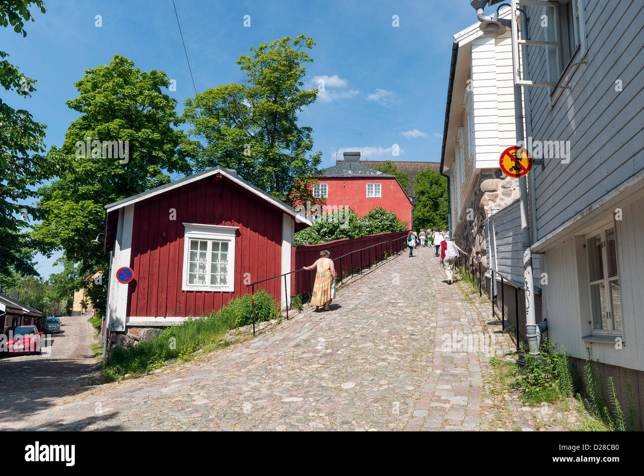 Traditional wooden houses lining the cobbled stone streets of Old Porvoo in Finland Stock Photo
