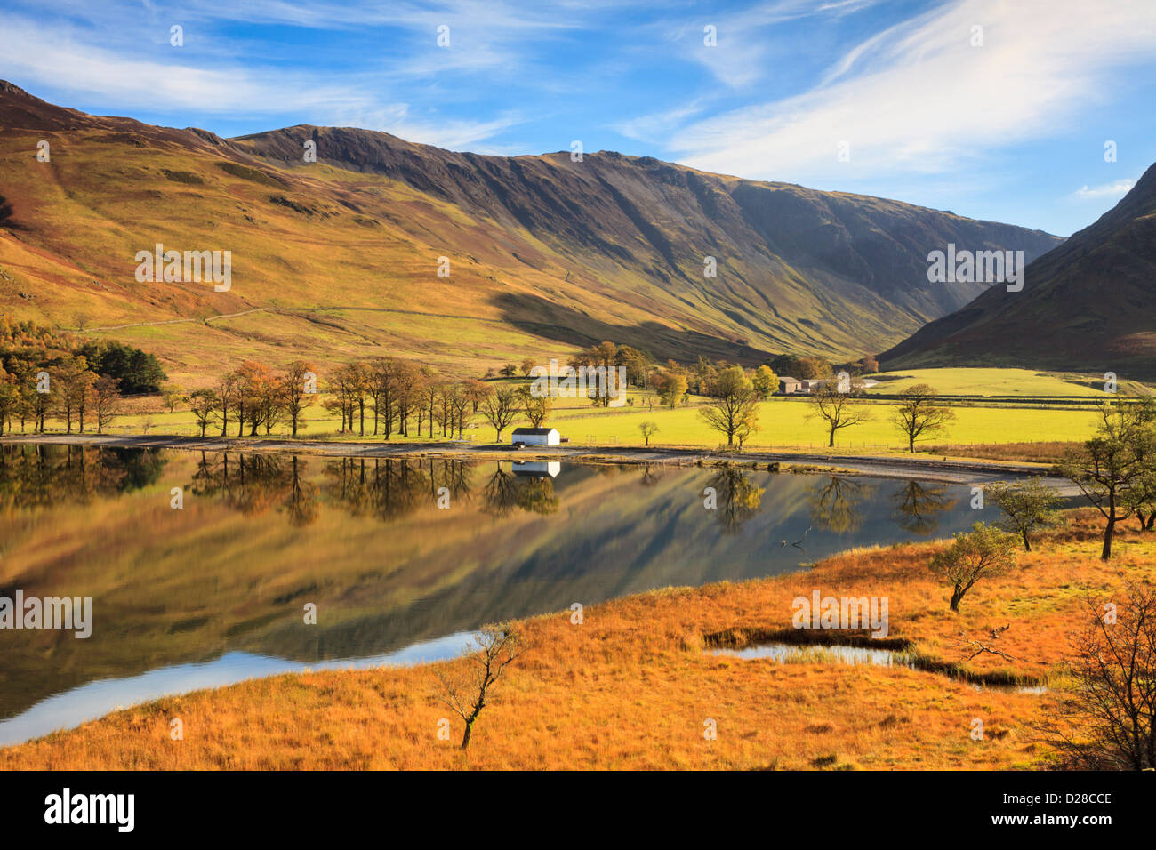 The southern end of Buttermere in the Lake District National Park captured from the footpath above the west shore on a still mor Stock Photo