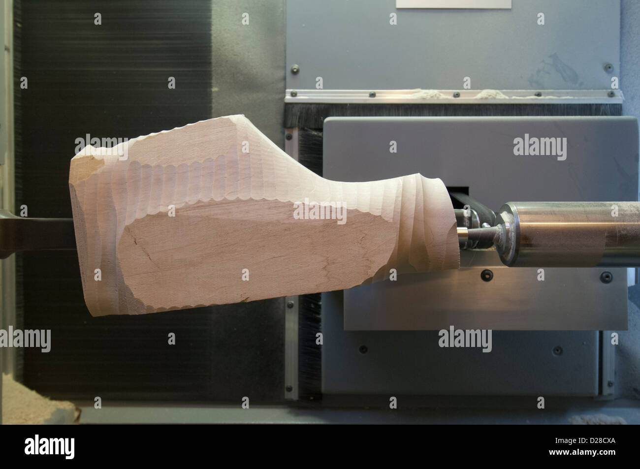 A shoe Last (foot shaped forms used to make shoes) is carved by a 3d