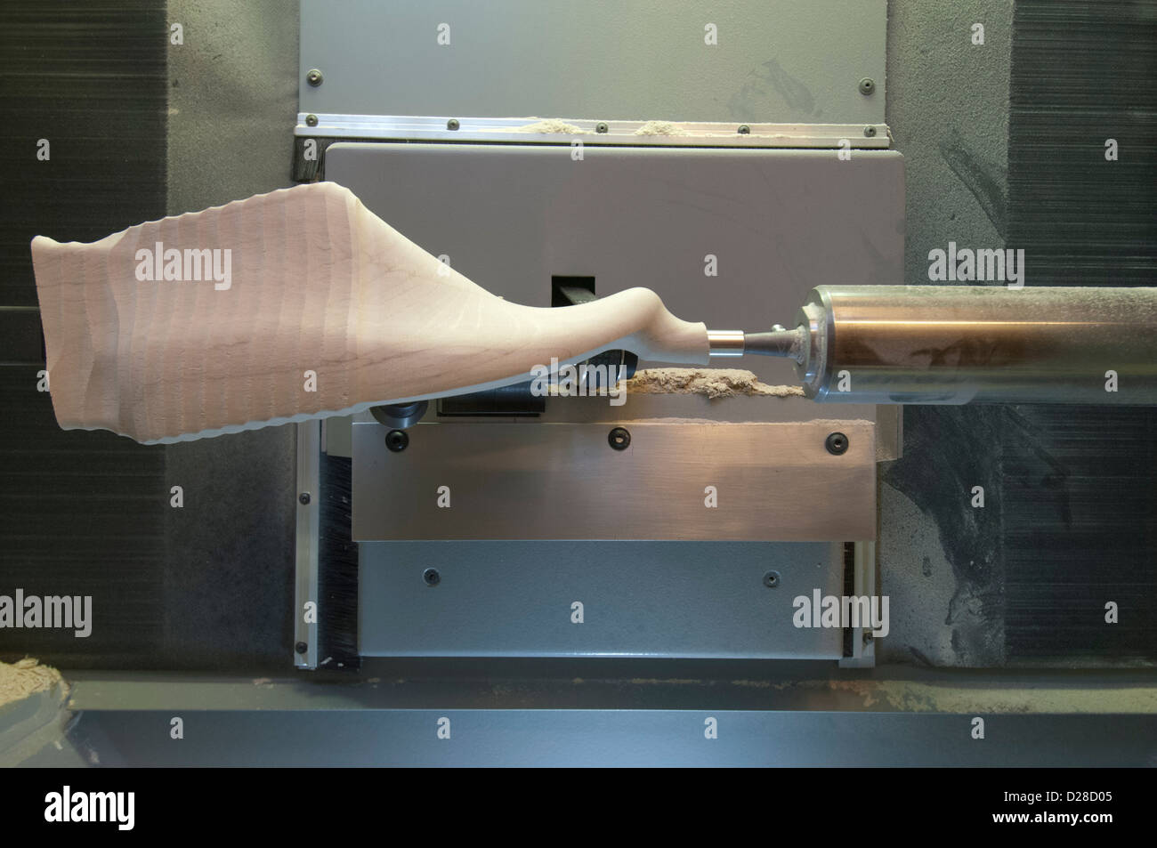 A shoe Last (foot shaped forms used to make shoes) is carved by a 3d