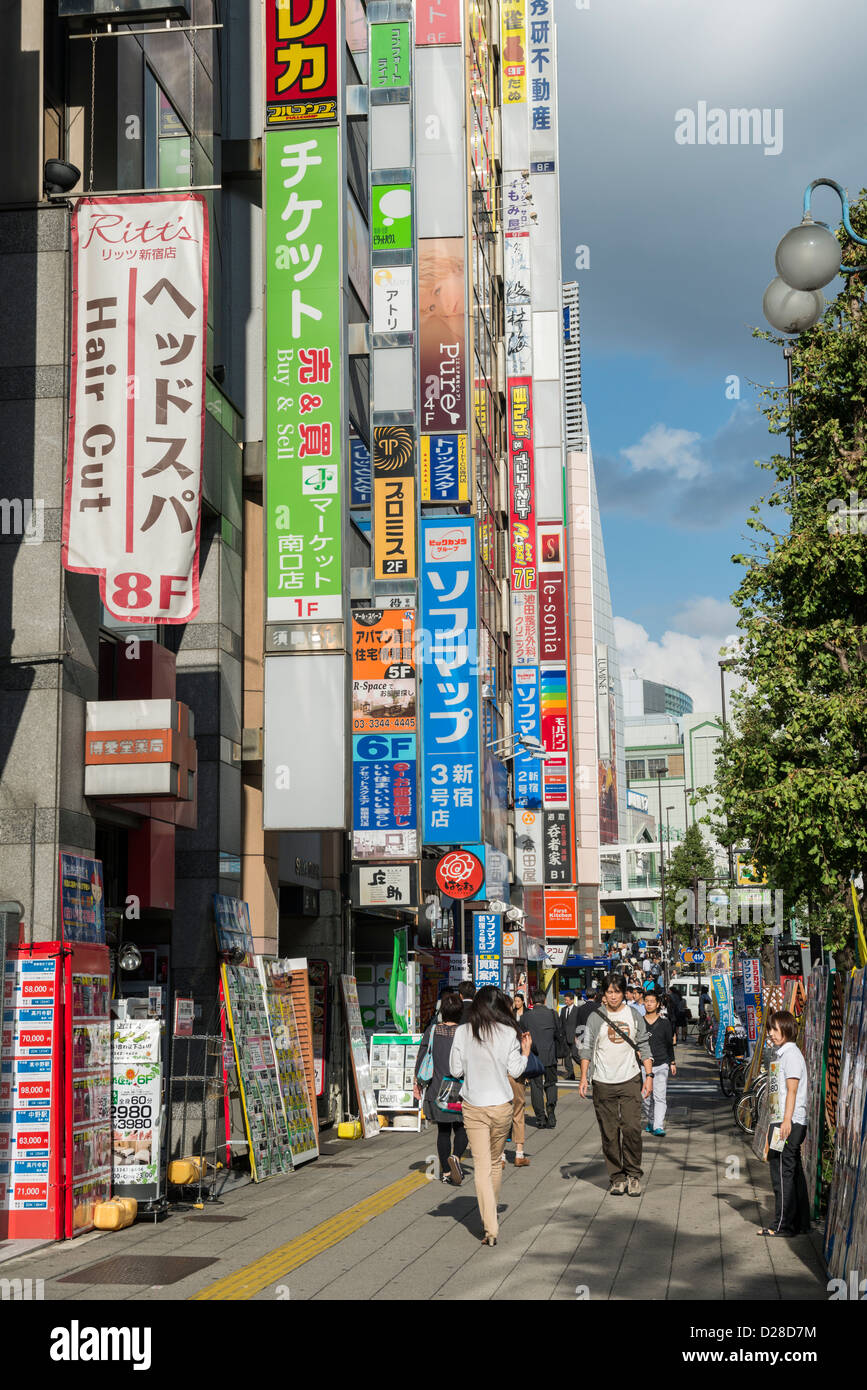 Busy Shopping Street Scene in Shinjuku, Tokyo Japan Stock Photo