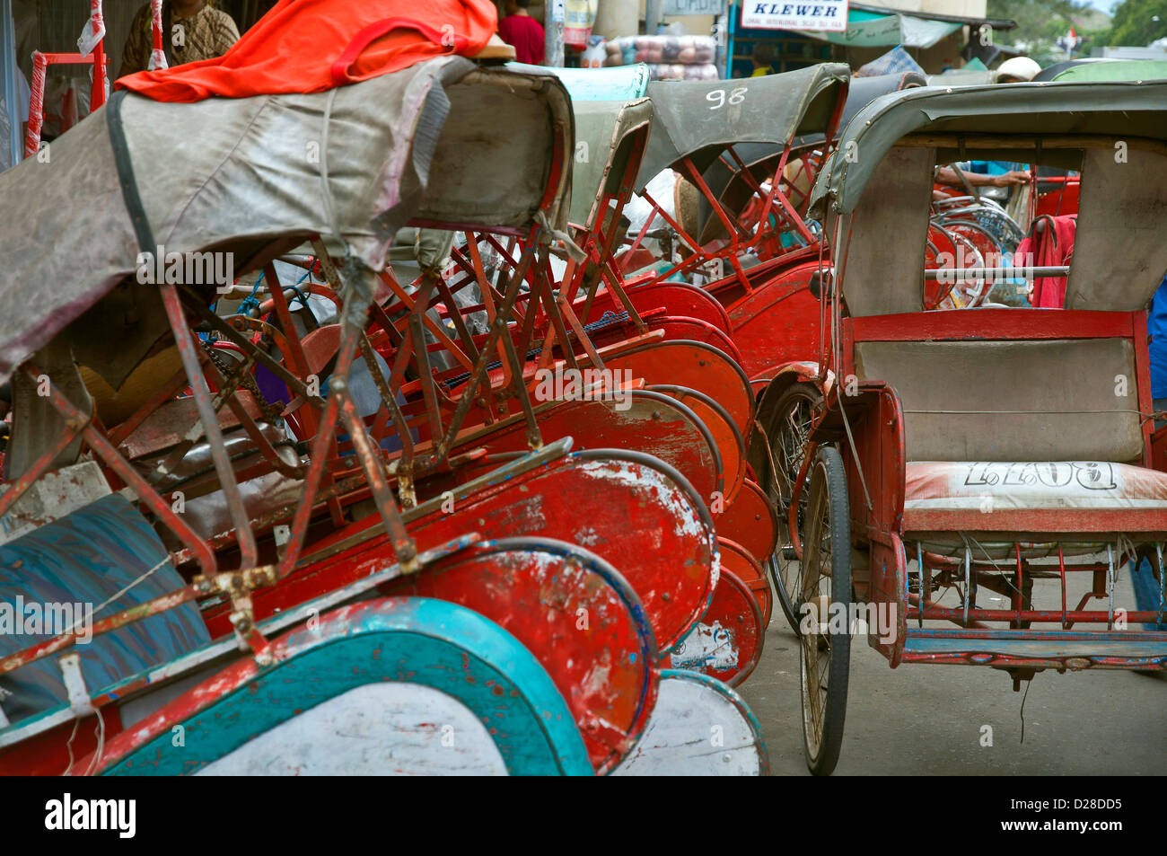 Trishaws in the street of Surakarta, Indonesia Stock Photo