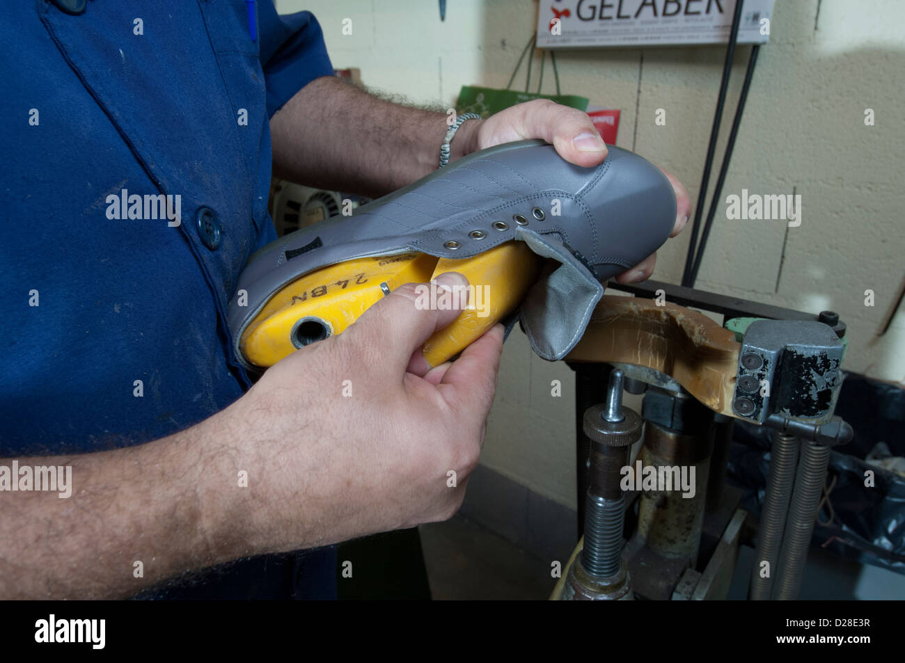 A shoe maker removed the last during the manufacturing process Stock Photo