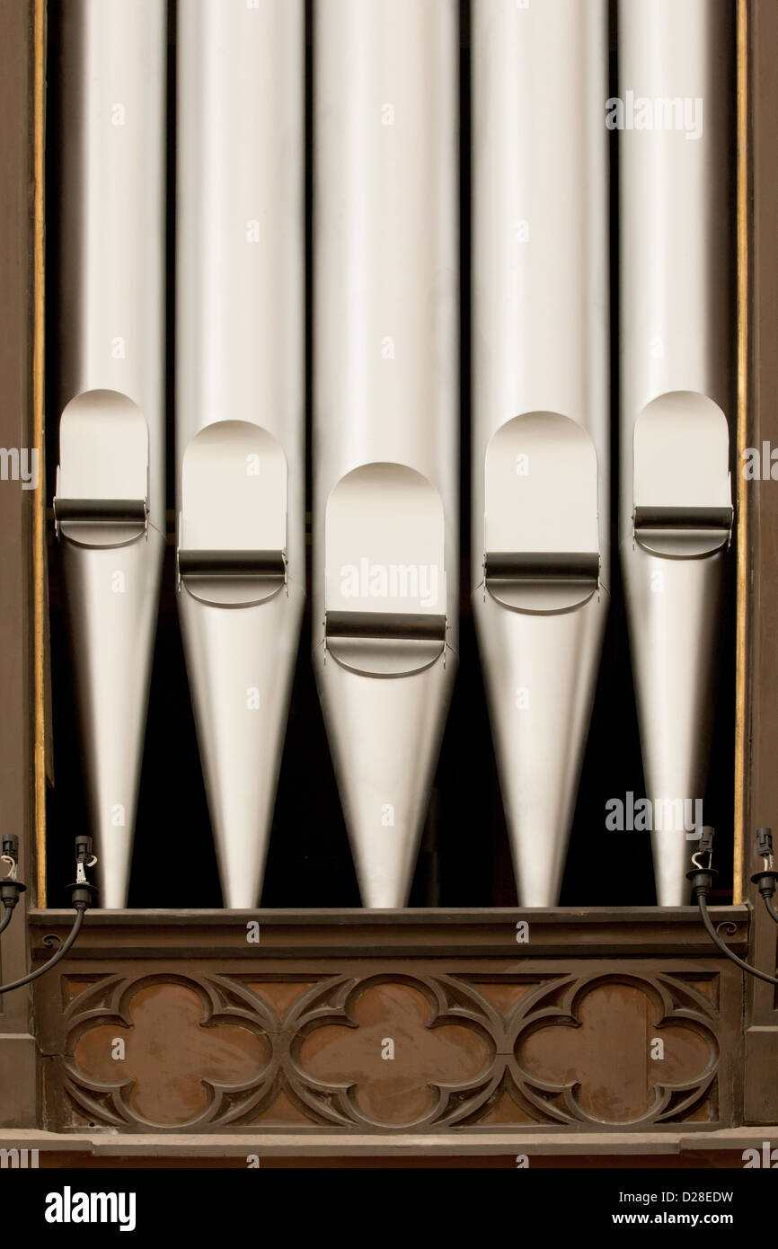 A close-up of antique silver organ pipes. Stock Photo