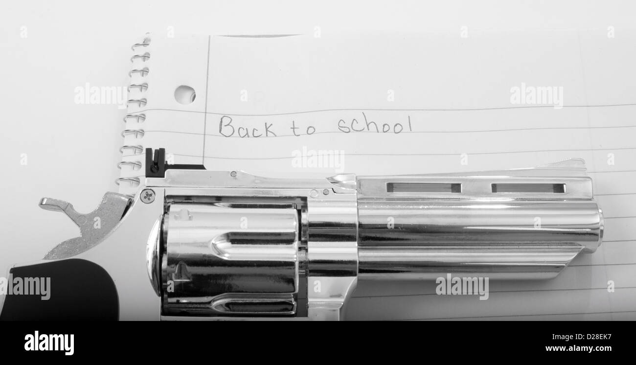 Handgun with school notebook paper Stock Photo - Alamy