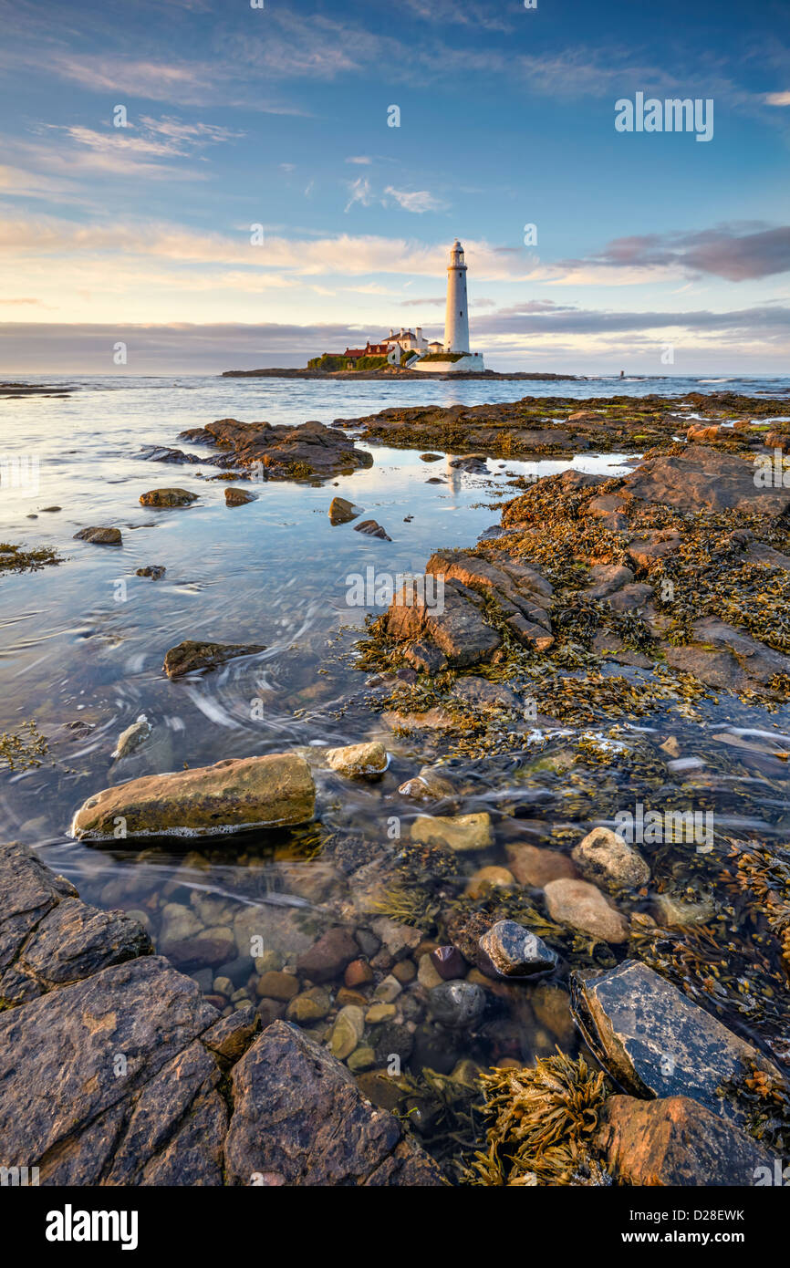 St Mary's Lighthouse near Whitley Bay on the North Tyneside coast.  Captured at high tide  using a long shutter speed to blur th Stock Photo