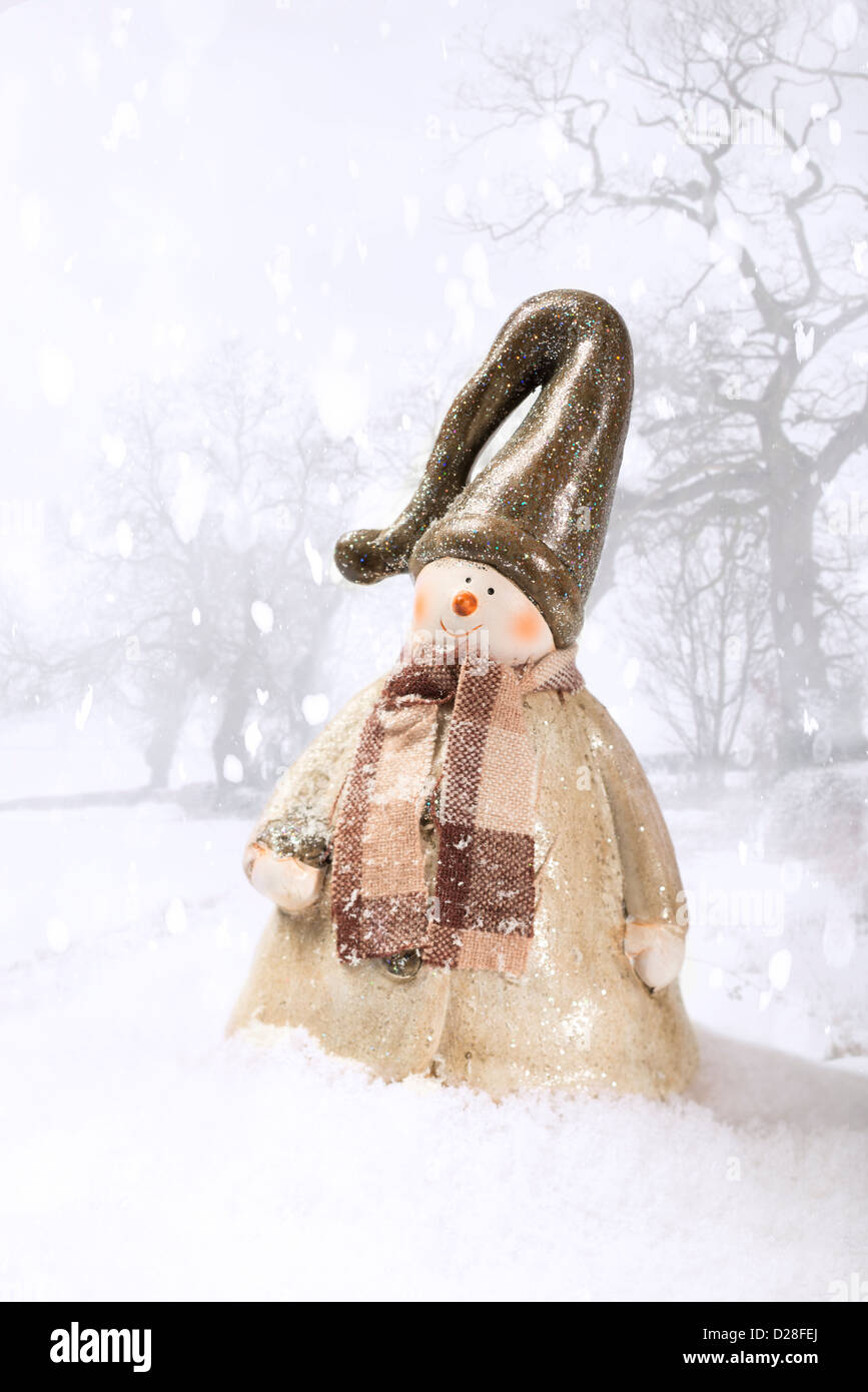 Winter snowy scene with cheerful Christmas snowman Stock Photo