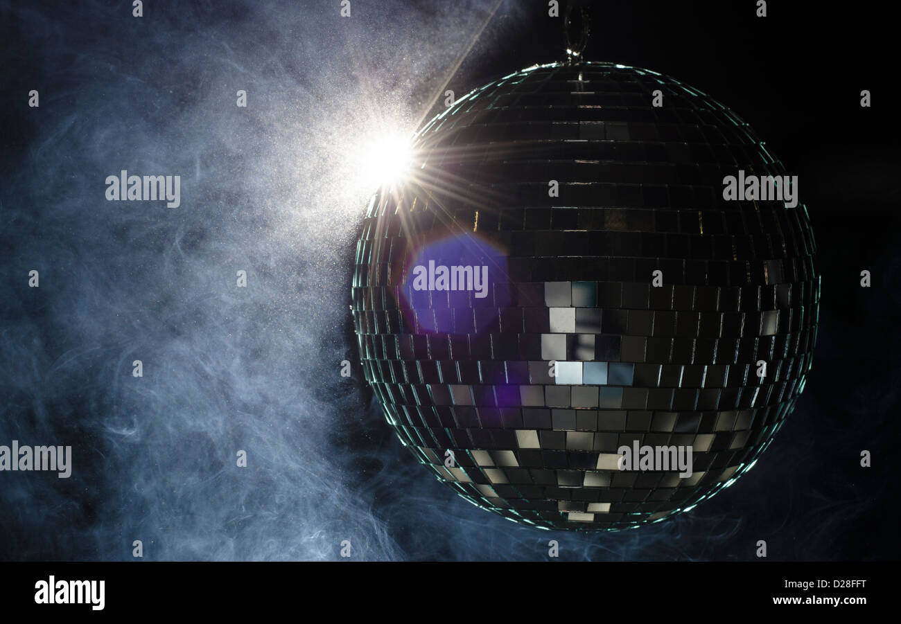 A disco ball with light flare. A nightlife image to be used as example on party fliers. Stock Photo