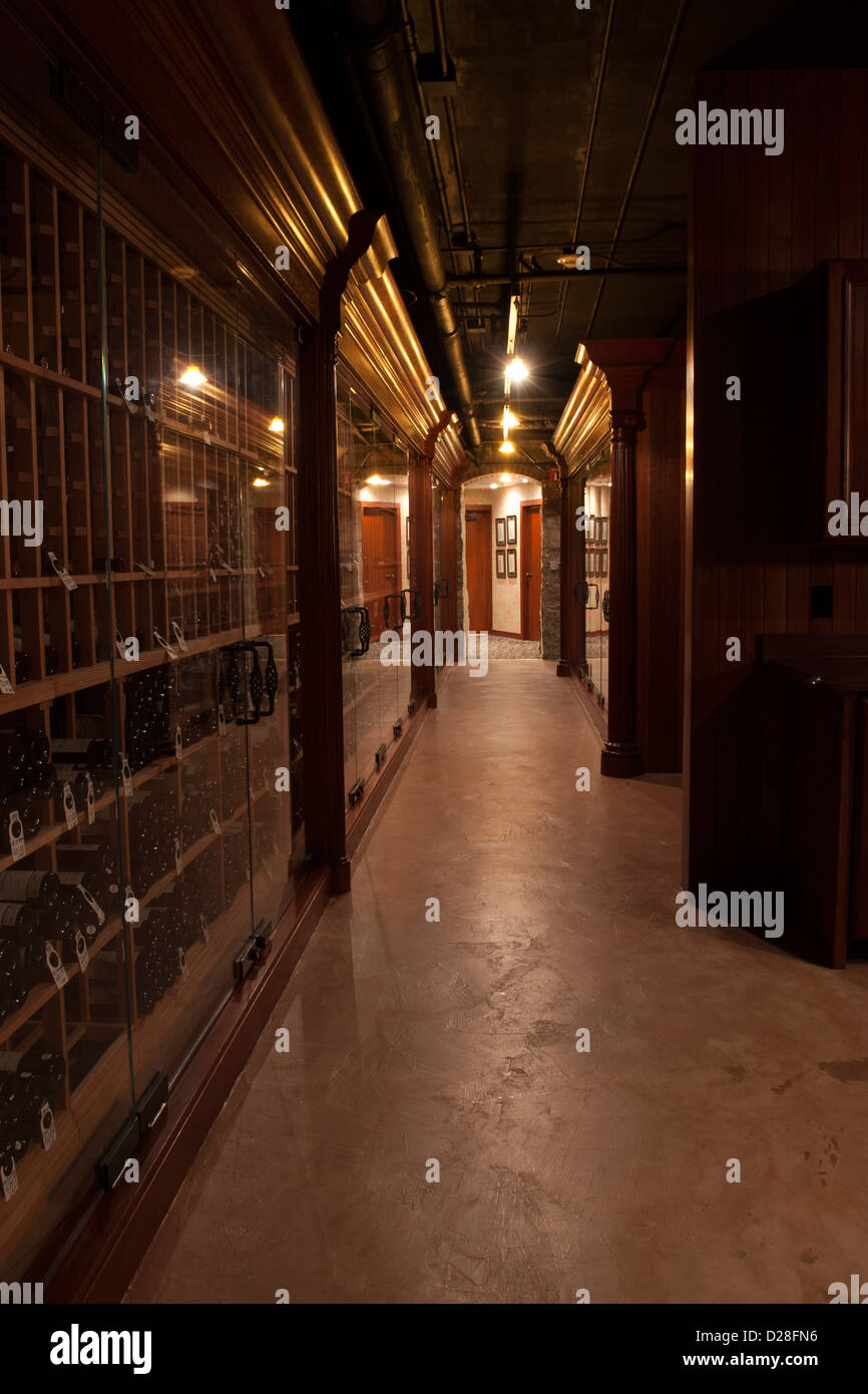Upscale restaurant has an extensive wine cellar with elaborate woodwork. Stock Photo