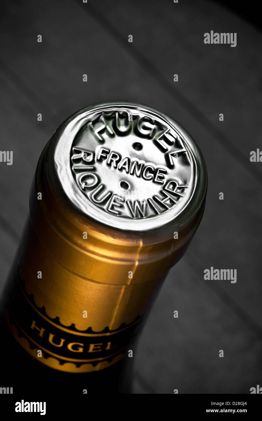 Close up foil capsule on wine bottle top in wine cellar situation of