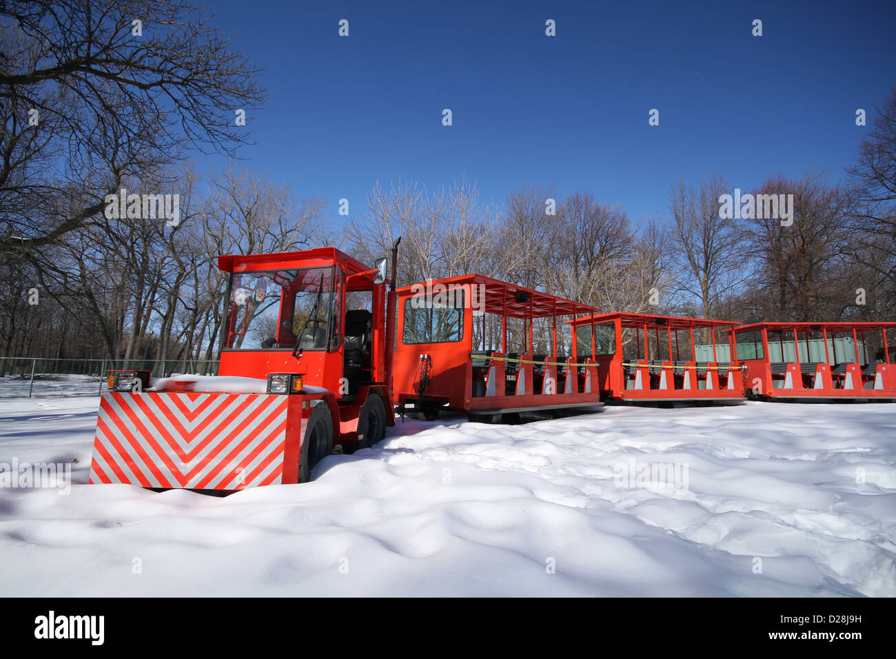 Red train under blue sky in winter Stock Photo