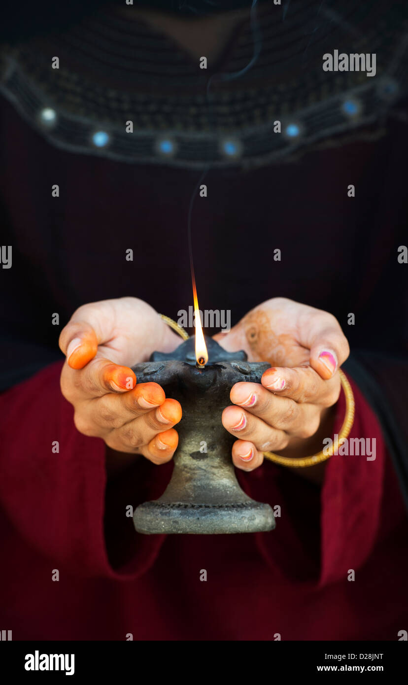Teenage Indian girl holding a lit oil lamp Stock Photo Alamy