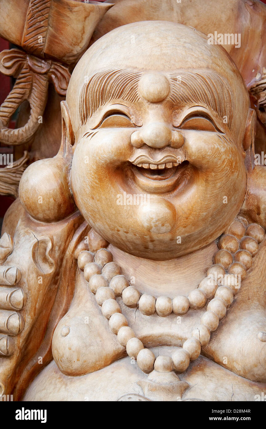 Wooden buddha statue Stock Photo