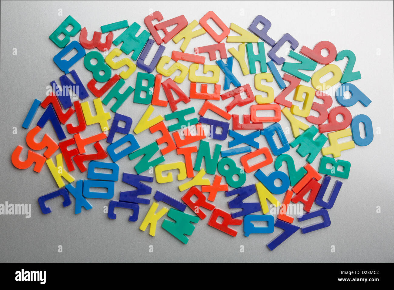 Refrigerator magnet letters jumbled up in a random pattern Stock Photo