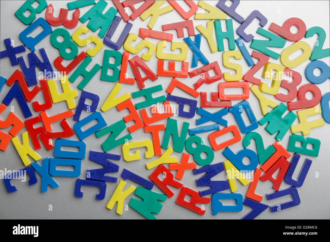 Refrigerator magnet letters jumbled up in a random pattern Stock Photo