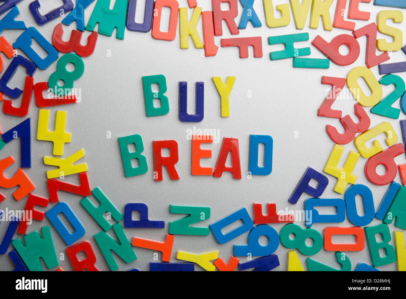 Refrigerator magnets spell messages out of a jumble of letters Stock Photo