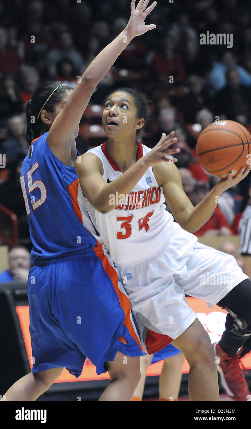 Jan. 16, 2013 - Albuquerque, NM, U.S. - UNM's #34 Whitney Johnson looks to the hoop as she goes by Boise State's #15 Lexie Der in the first half of their game Wed. night in the Pit. UNM came from behind to get the win over the Broncos 58-53 for the Lobos first conference win. Wednesday, Jan,16, 2013. (Credit Image: © Jim Thompson/Albuquerque Journal/ZUMAPRESS.com) Stock Photo