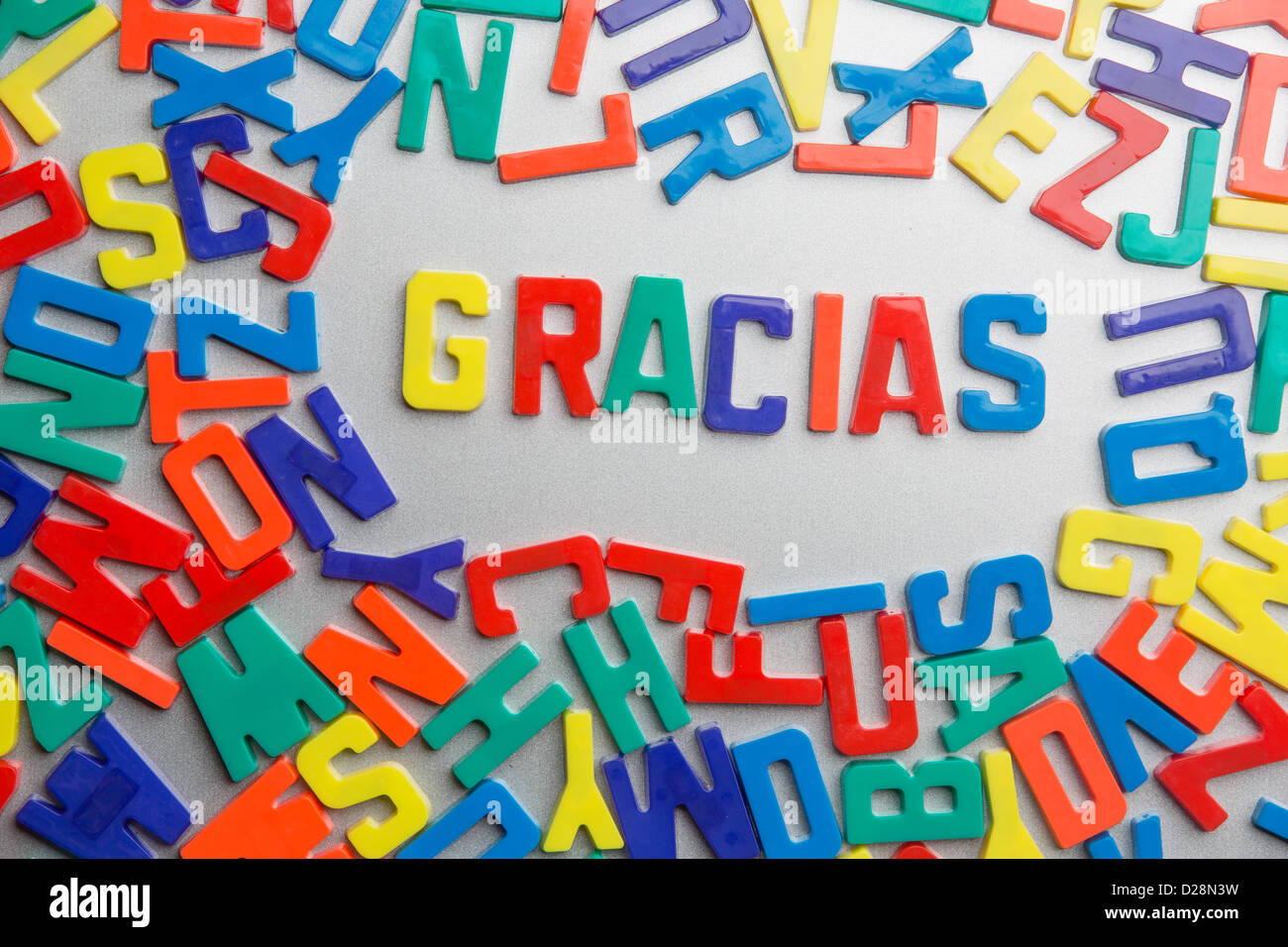 'Gracias' - Refrigerator magnets spell a message out of a jumble of letters Stock Photo