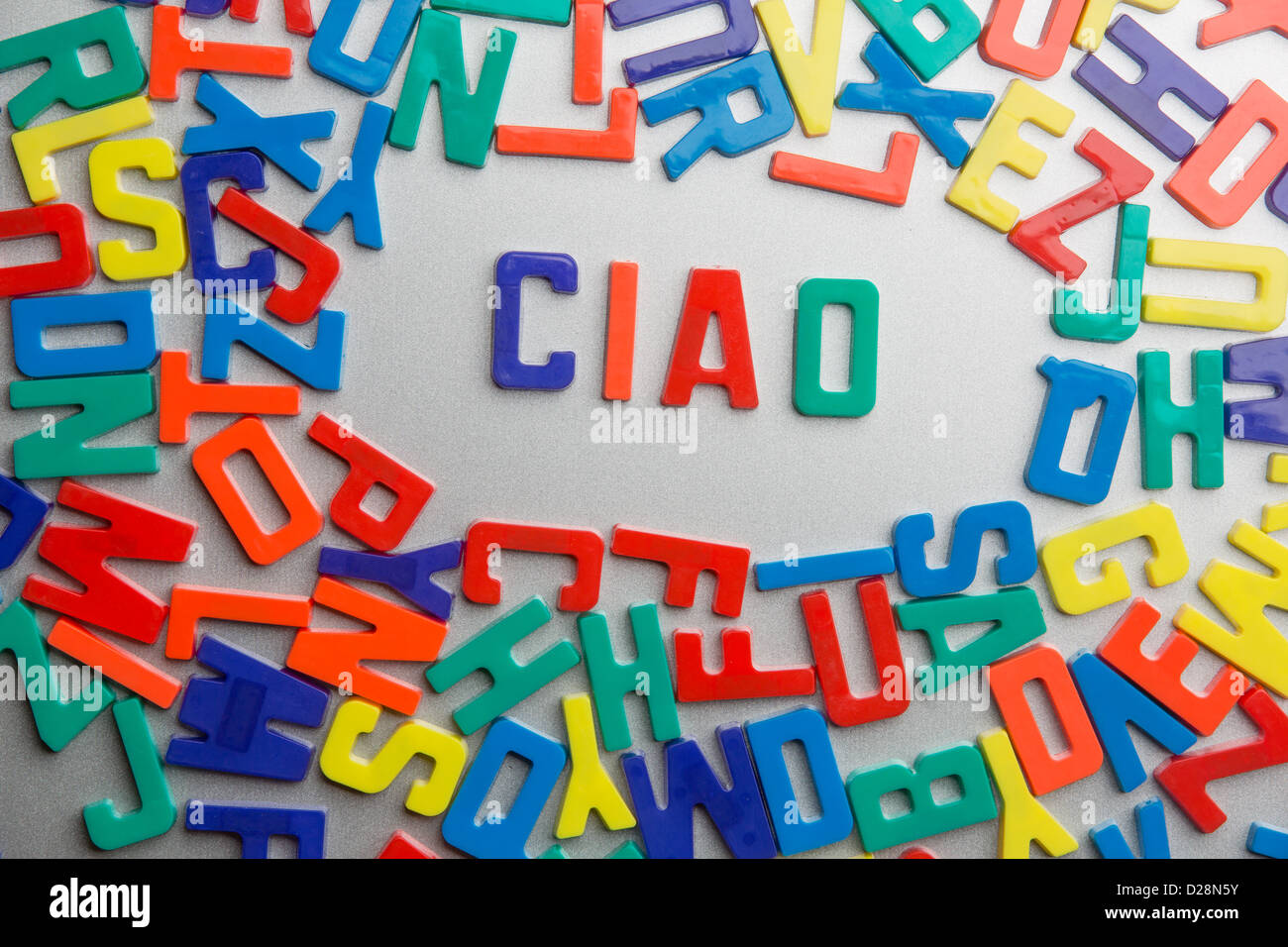 'Ciao' - Refrigerator magnets spell a message out of a jumble of letters Stock Photo