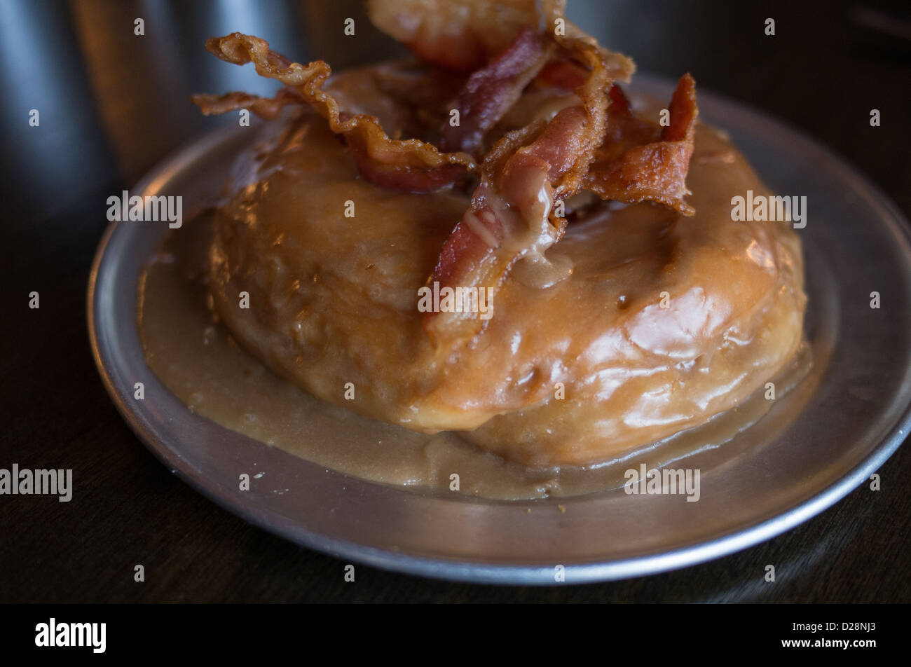 Bacon maple syrup donut at Gourdough's in Austin, Texas Stock Photo
