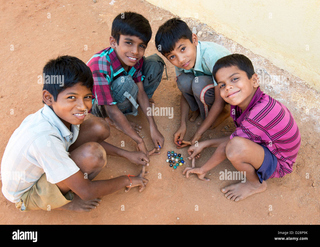 indian-boys-playing-marbles-in-a-rural-i