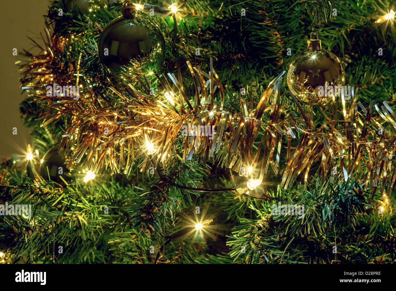 glowing lights on a Christmas tree with yellow and green balls Stock ...