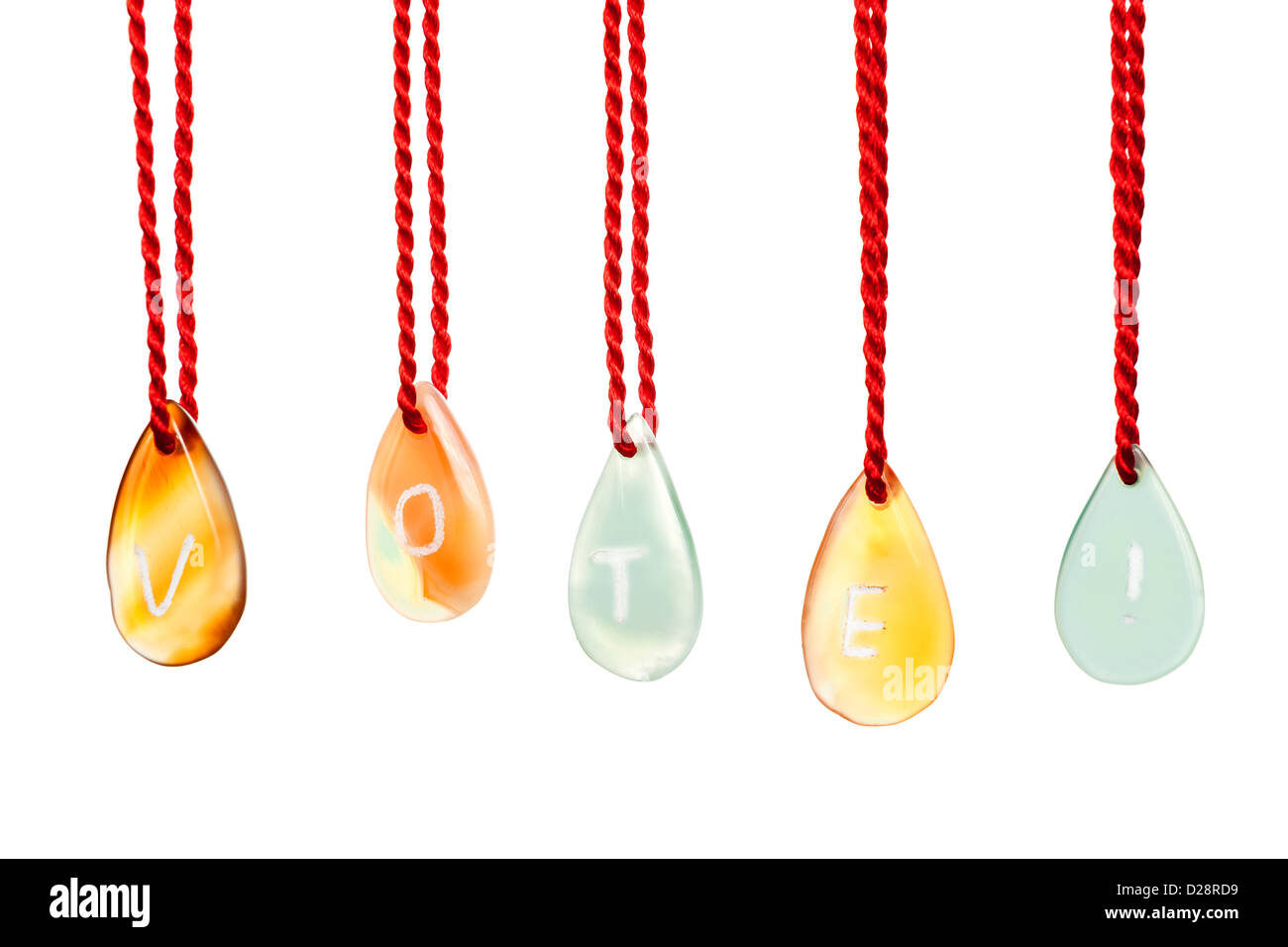 Vote word spelled with agates that are engraved with white letters and are hung by ropes, isolated against white background Stock Photo