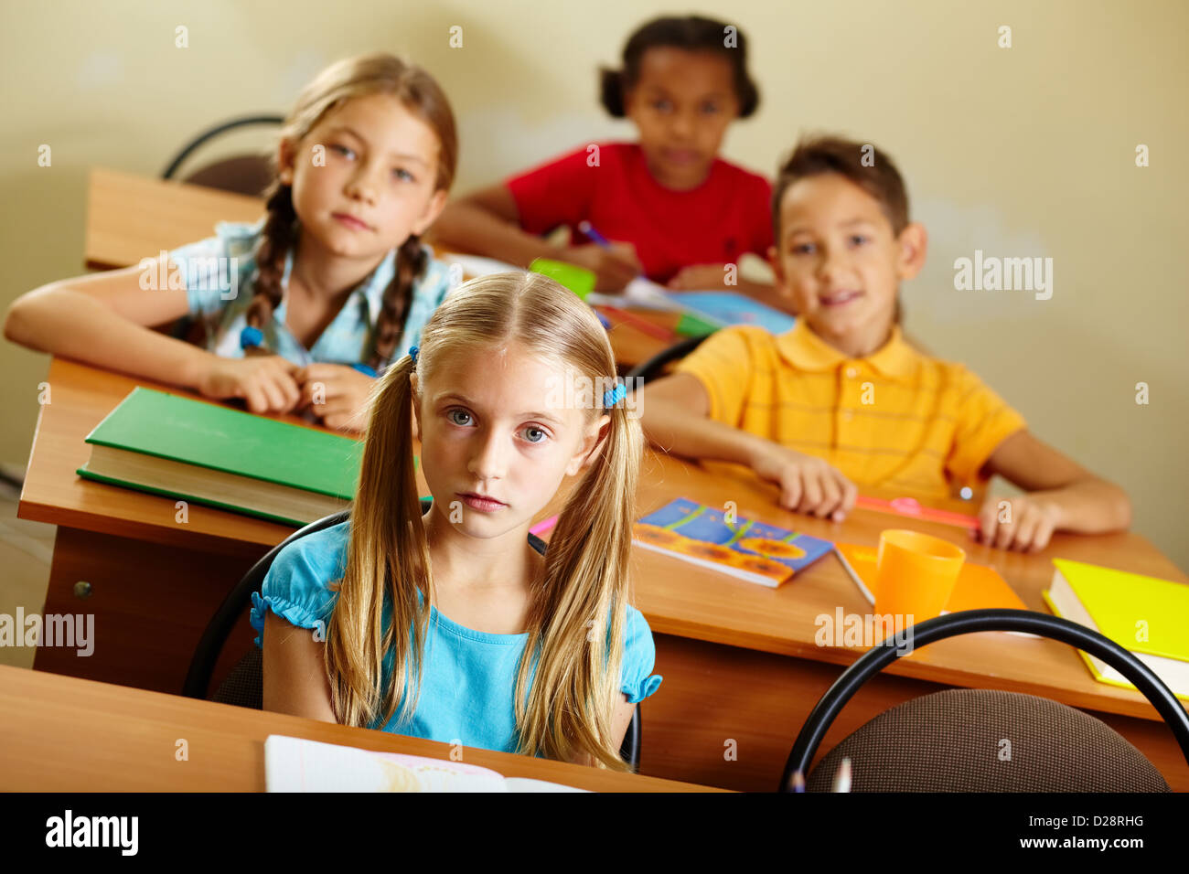 Portrait of lovely girl looking at camera at lesson Stock Photo