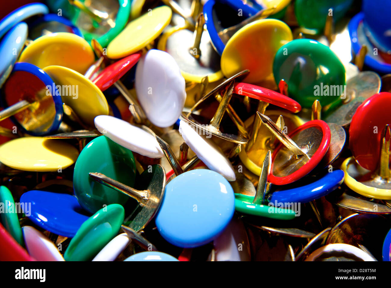 Colorful pushpins in various angles. Thumbtack. Stock Photo
