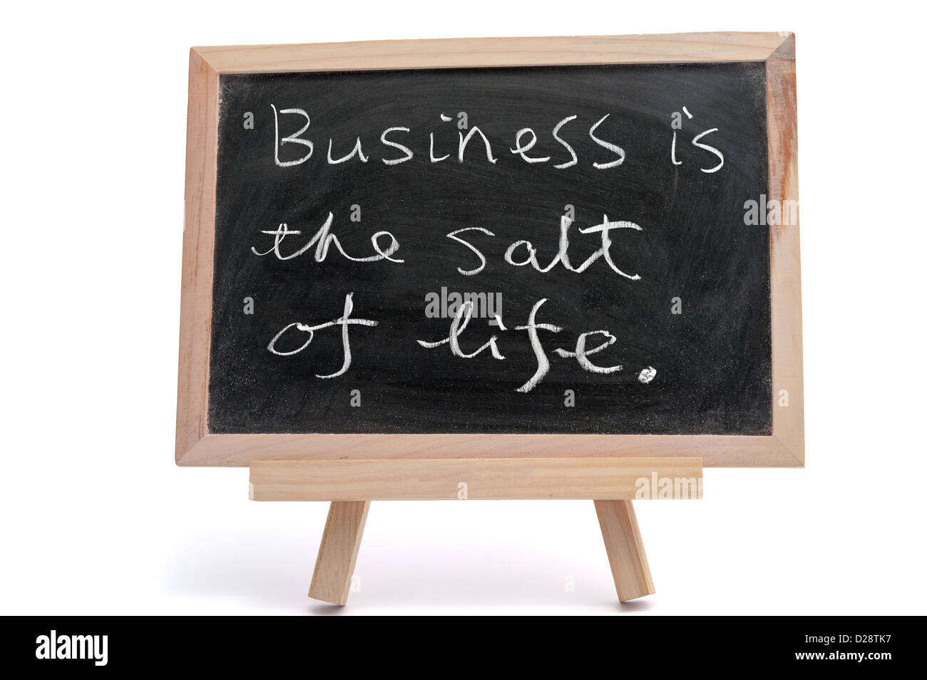 'Business is the salt of life' saying written on blackboard Stock Photo