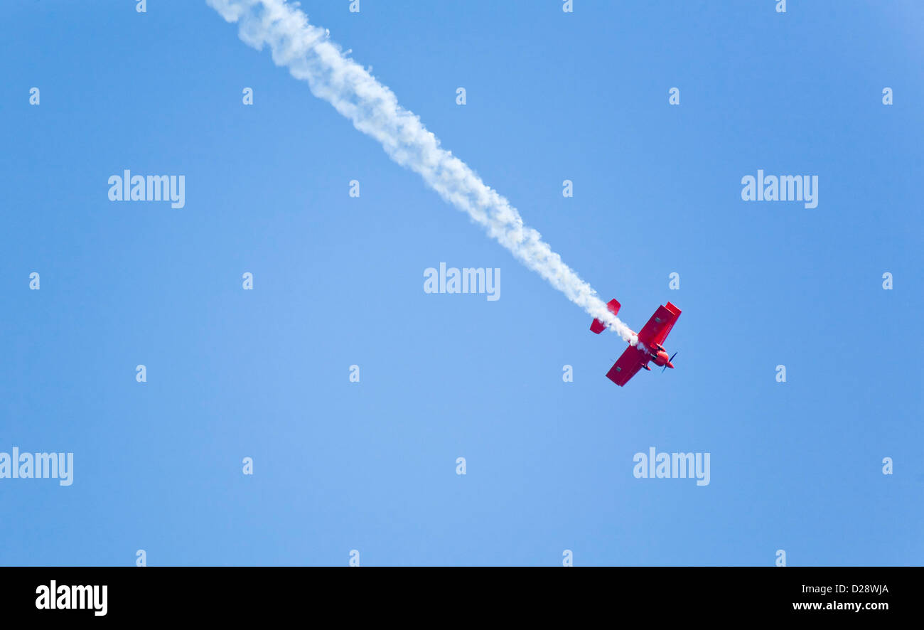 Red stunt plane in air Stock Photo