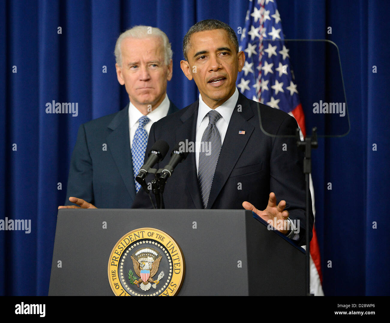 United States President Barack Obama makes remarks as Vice President Joe Biden listens at an event at the White House in Washington, D.C. to unveil a set of proposals to reduce gun violence on Wednesday, January 16, 2012..Credit: Ron Sachs / CNP Stock Photo