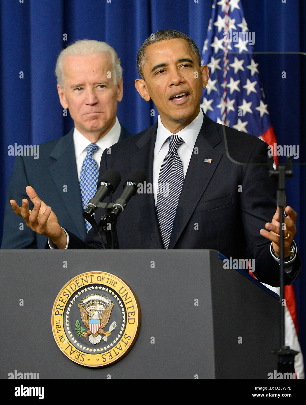 United States President Barack Obama makes remarks as Vice President Joe Biden listens at an event at the White House in Washington, D.C. to unveil a set of proposals to reduce gun violence on Wednesday, January 16, 2012..Credit: Ron Sachs / CNP Stock Photo