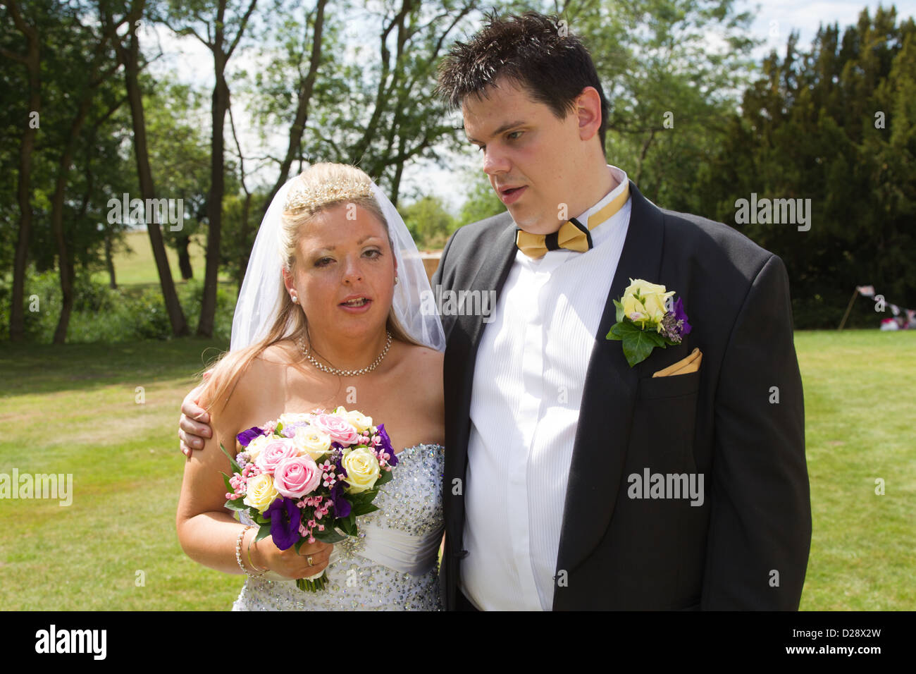 Visually impaired bride and groom posing for photos after marriage ...