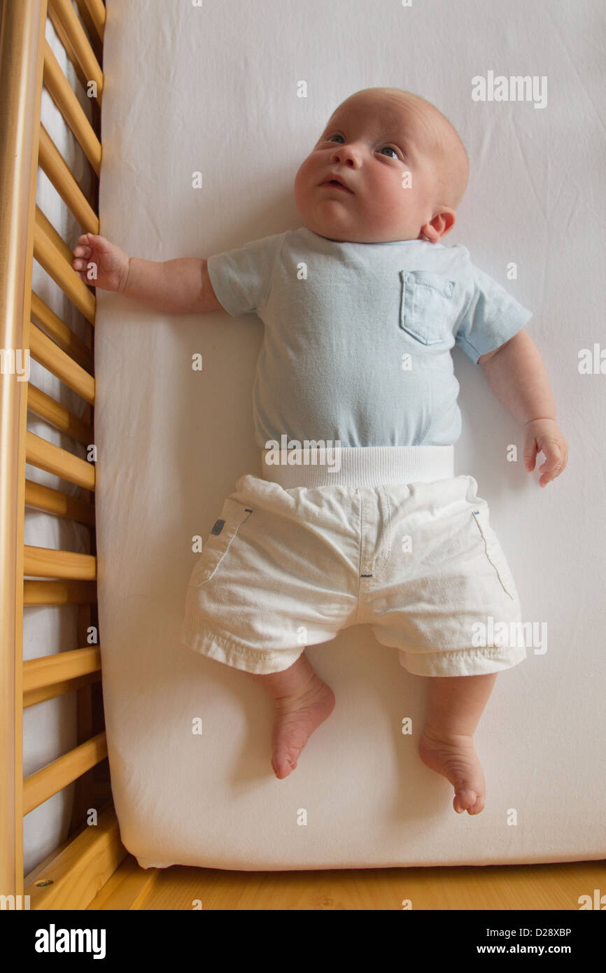 Baby in cot Stock Photo Alamy