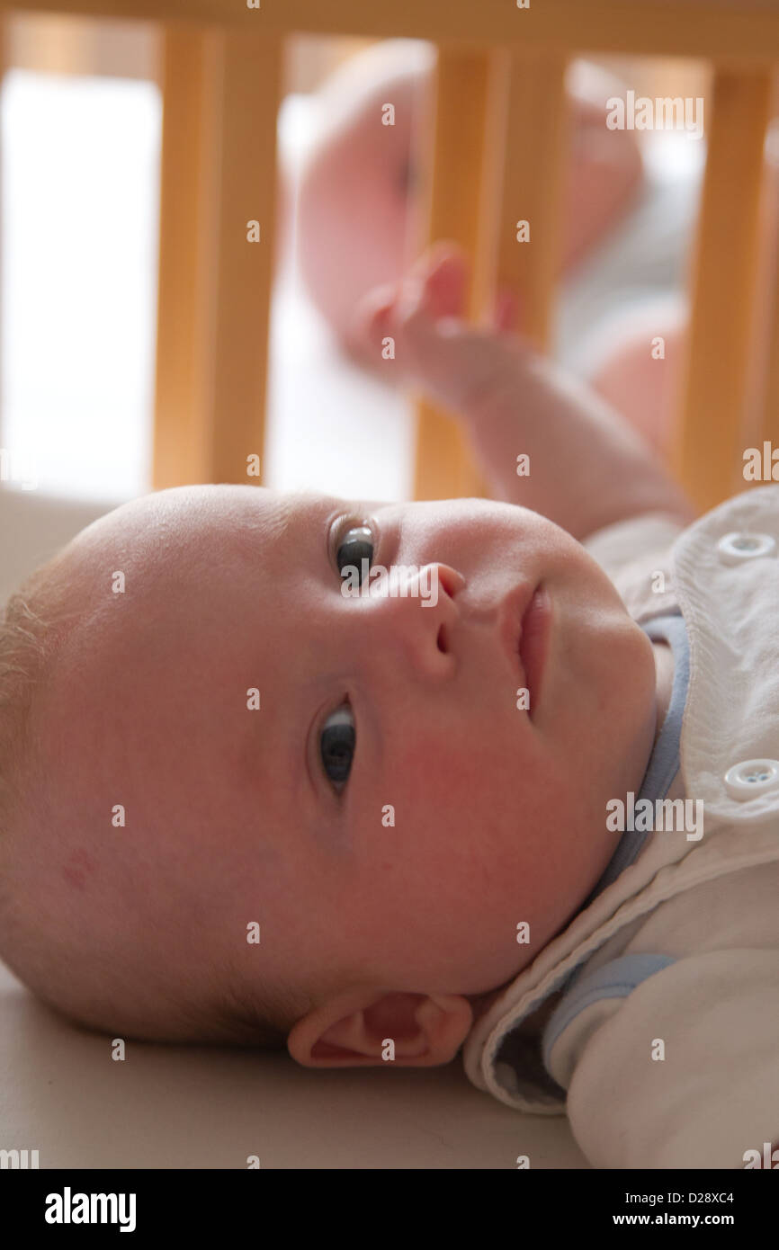 Twin babies in cot Stock Photo Alamy