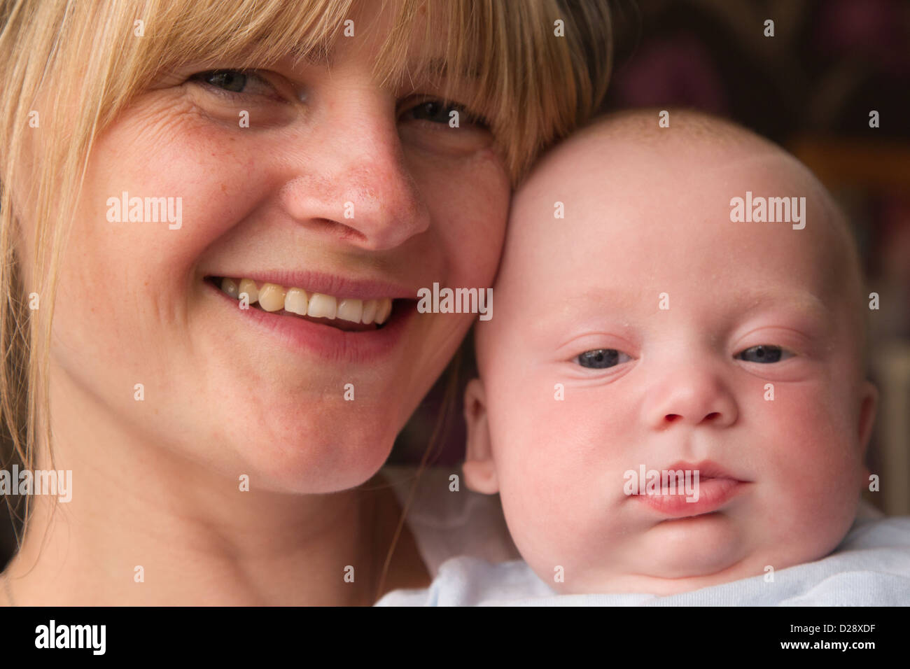 Mother holding baby. Stock Photo