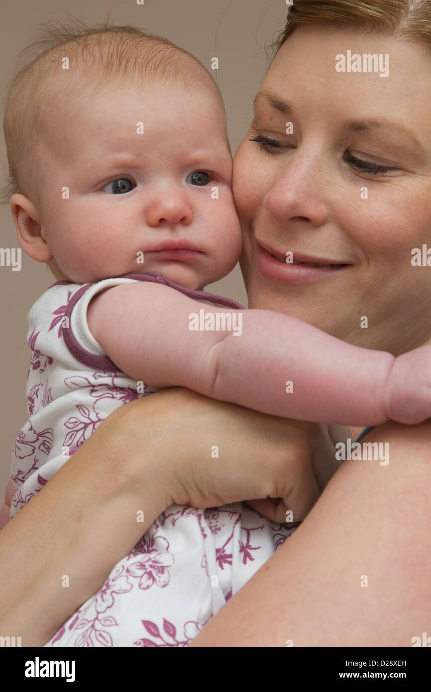 Mother holding baby Stock Photo Alamy