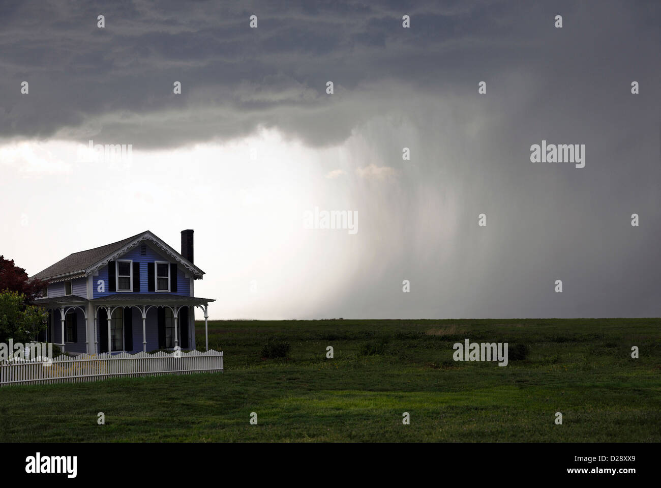 House and approaching storm Stock Photo Alamy
